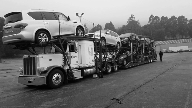 Our truck carrying multiple vehicles for transport