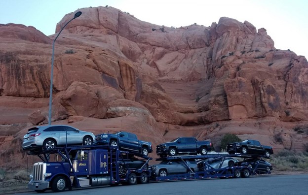 A truck transporting multiple cars