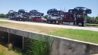 A truck transporting multiple cars